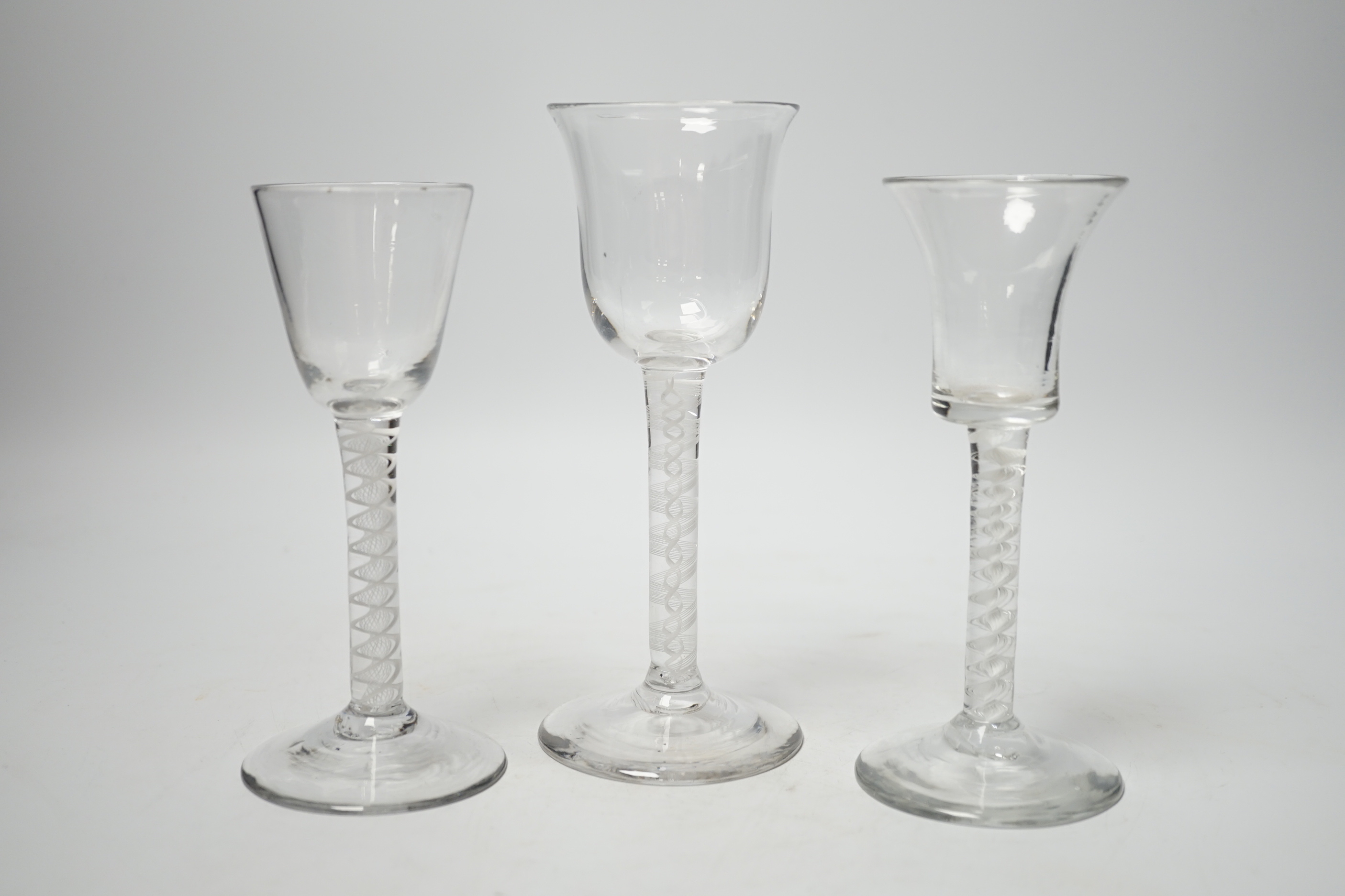 Three 18th century wine glasses with DSOT stems, two examples with bell-shaped bowls, tallest, 17cm